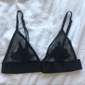 out from under black lace and mesh bralette